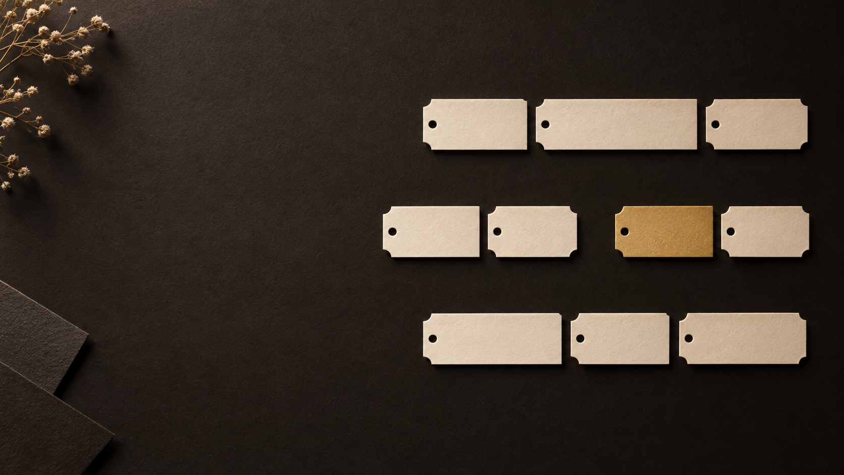Ivory scheduling tickets arranged into execution tracks on dark paper